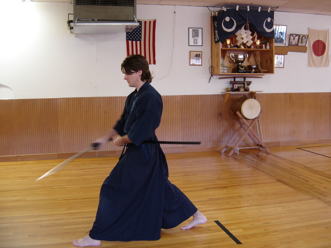 Iaido dojo practitioner demonstrating a draw kata